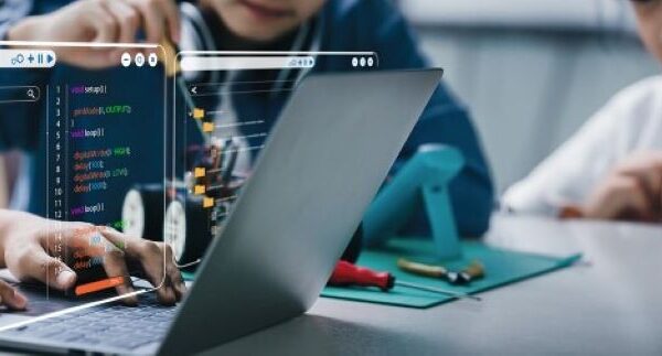 Students collaborating in a virtual STEM lab simulation on computers.