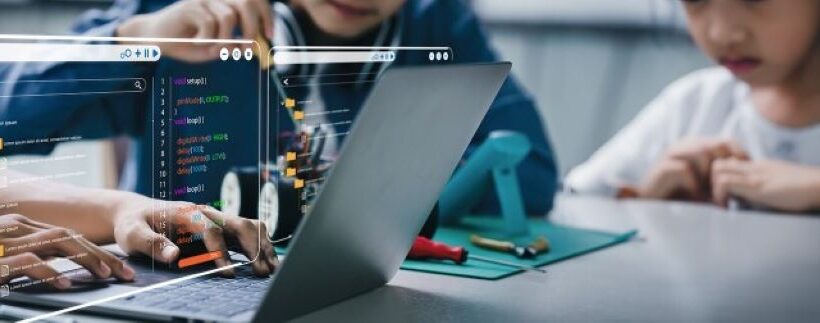 Students collaborating in a virtual STEM lab simulation on computers.